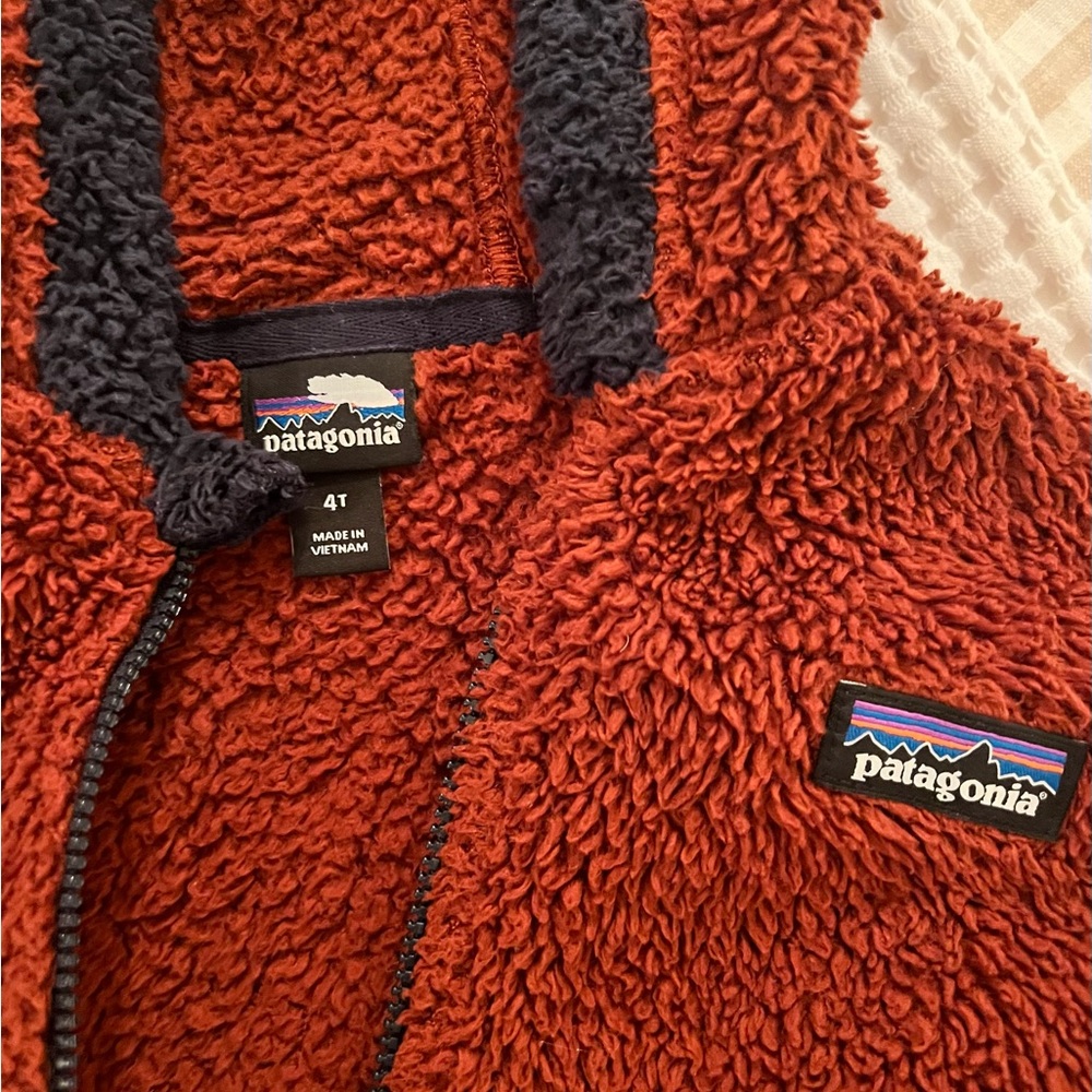 Red/brown and navy chunky fleece. No tears or stains.